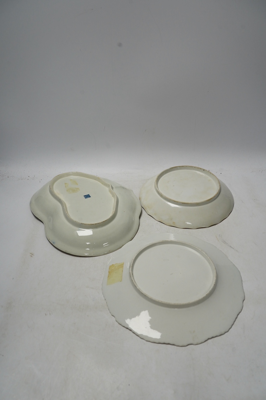 An 18th century Worcester dessert dish and two later Barr Flight & Barr plates, larger 26cm. Condition - worn